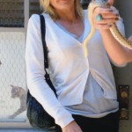 Jane’s white cardi and black mini on Happy Endings
