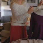 Alex’s white knit sweater and red skirt on Happy Endings
