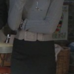 Jane’s grey sweater and mini skirt on Happy Endings