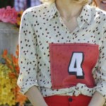 Lemon’s red pants, white printed blouse and cream hat on Hart of Dixie