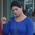 Penny’s cobalt blue sweater with circle necklace on Happy Endings