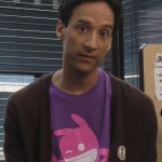 Abed’s purple shirt with pink character on it on Community
