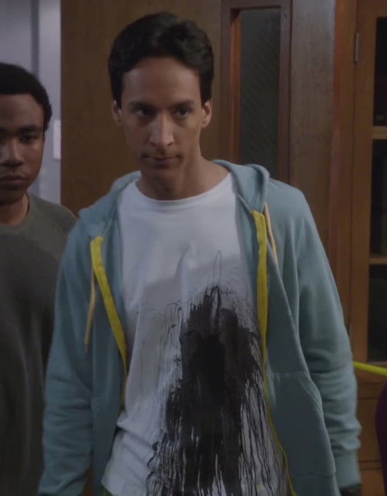 Abed’s white shirt with black ink splash graphic and blue cardigan on Community