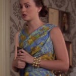 Blair’s blue and yellow dress with gold bracelet and blue clutch on Gossip Girl