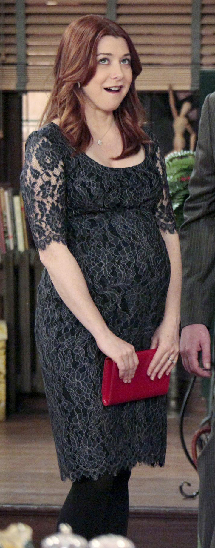 Lily’s lace maternity dress and red clutch on How I Met Your Mother