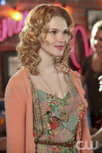 Magnolia's paisley jumper/romper under a cropped peach rosette cardigan and circle necklace on Hart of Dixie