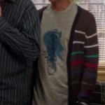Abed’s grey shirt with blue graphic and rainbow striped cardigan on Community