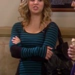 Penny’s blue striped longsleeve top and black handbag on The Big Bang Theory