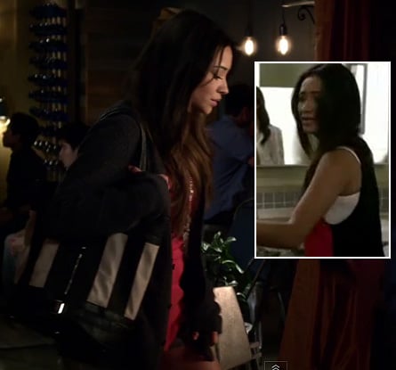 Emily's pink and black contrast back top with striped bag on Pretty Little Liars