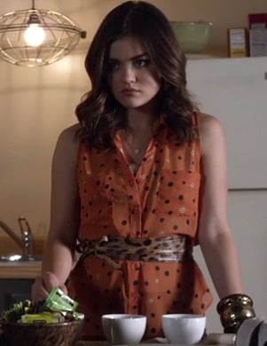 Aria's orange polka dot top and leopard print belt on Pretty Little Liars