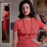 Megan’s coral dress and gold chain necklace on Mad Men