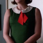 Peggy’s green, red and white collared dress with tie on Mad Men