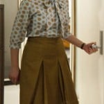 Peggy’s mustard pleated skirt and printed blouse on Mad Men