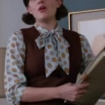 Peggy’s printed blouse under a brown dress on Mad Men