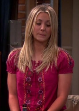 Penny’s red peasant style top on Big Bang Theory