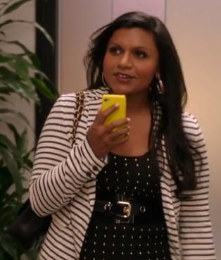 Mindy's polka dot top, striped cardigan and yellow iphone cover on The Mindy Project