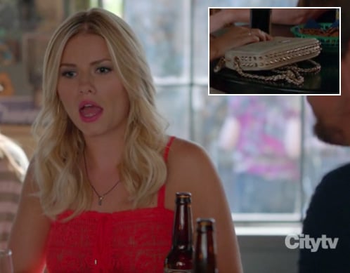 Alex's red lace top and cream studded purse on Happy Endings