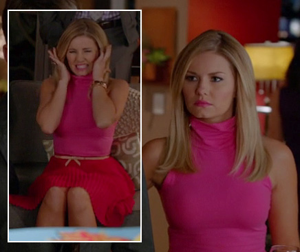 Alex’s neon hot pink top with red pleated skirt and bow belt on Happy Endings
