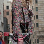 Carrie’s floral blouse with bow and black paint splatter bag on The Carrie Diaries