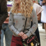 Carrie’s grey alphabet sweater with red horse jeans on The Carrie Diaries