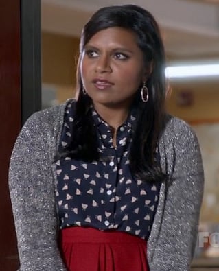 Mindy's navy blue printed shirt, red skirt and silver metallic cardigan on The Mindy Project