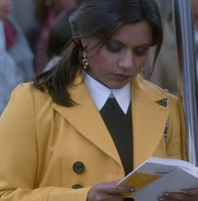 Mindy's yellow coat on the train on The Mindy Project