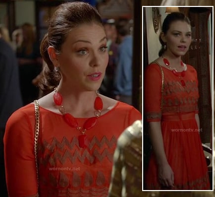 AnnaBeth's coral orange dress with gold zig zag pattern on Hart of Dixie