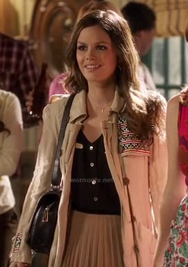 Zoe’s embroidered trench coat, black top and beige pleated skirt on Hart of Dixie