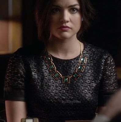 Aria's black textured short sleeve dress and green square necklace on Pretty Little Liars