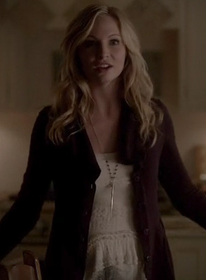 Caroline’s white textured peplum top and purple cardigan on The Vampire Diaries