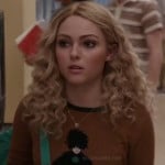 Carrie’s brown sweater with lady on it on The Carrie Diaries