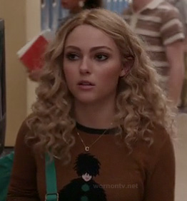 Carrie's brown sweater with lady on it on The Carrie Diaries