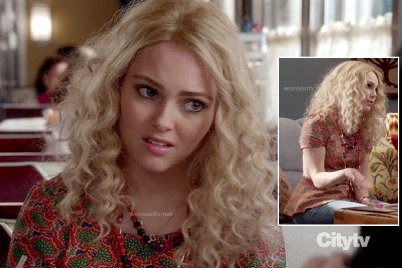 Carrie’s orange and green tree print peplum top on The Carrie Diaries