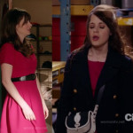 Jess’s pink/magenta dress with navy coat and blue and white crossbody bag on New Girl