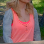 Alex’s neon orange tank top and grey striped shrug on Happy Endings