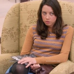 April’s beige sweater with green patterned stripes on Parks and Rec