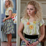 Carrie’s cassette tape print skirt, gerbera necklace and pink polka dot heels on The Carrie Diaries