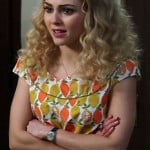 Carrie’s orange and lemon print top and yellow pleated skirt on The Carrie Diaries