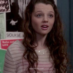 Dorrit’s sheer white striped sweater with shoulder buttons on The Carrie Diaries