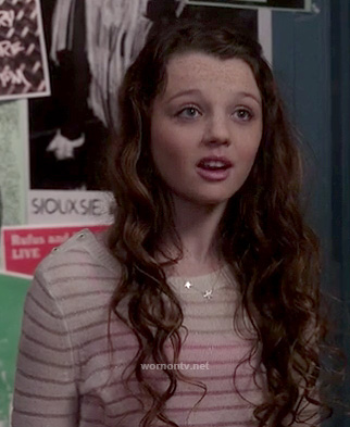 Dorrit’s sheer white striped sweater with shoulder buttons on The Carrie Diaries