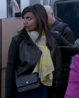 Mindy's leather panel jacket, yellow scarf and blue/black skirt on The Mindy Project