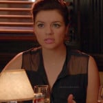 Penny’s black sleeveless shirt with sheer panels on Happy Endings