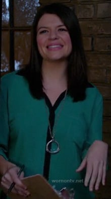 Penny's green blouse with contrast trim and long silver circle necklace on Happy Endings