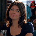 Penny’s navy eyelet dress and feather necklace on Happy Endings