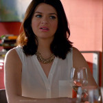 Penny’s white sleeveless button front top on Happy Endings