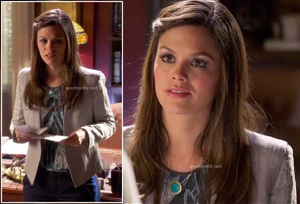 Zoe's light grey blazer, feather print top, pants with blue side stripes and turquoise circle necklace on Hart of Dixie