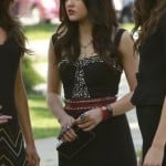 Aria’s black beaded dress with red studded belt at the funeral on Pretty Little Liars