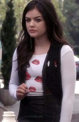 Aria’s white lips print top and beaded vest on Pretty Little Liars