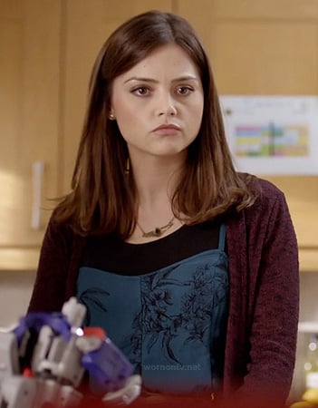 Clara's blue printed dress and burgundy cardigan on Doctor Who