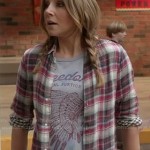 Polly’s “Freedom” tee and red plaid shirt on How To Live With Your Parents